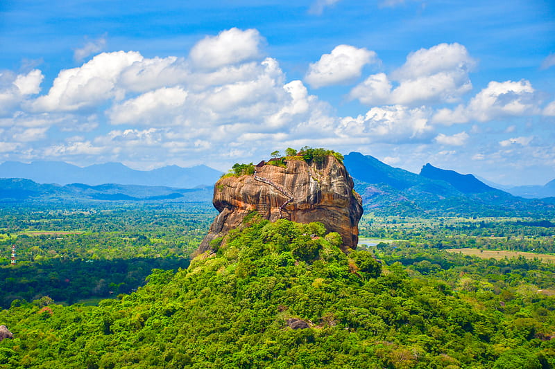 Sigiriya or Sinhagiri is an ancient rock fortress located in the northern Matale District near the town of Dambulla in the Central Province, Sri Lanka.The Sigiriya site contains the ruins of an upper palace located on the flat top of the rock, a mid-level terrace that includes the Lion Gate and the mirror wall with its frescoes, the lower palaces clings to the slopes below the rocks.